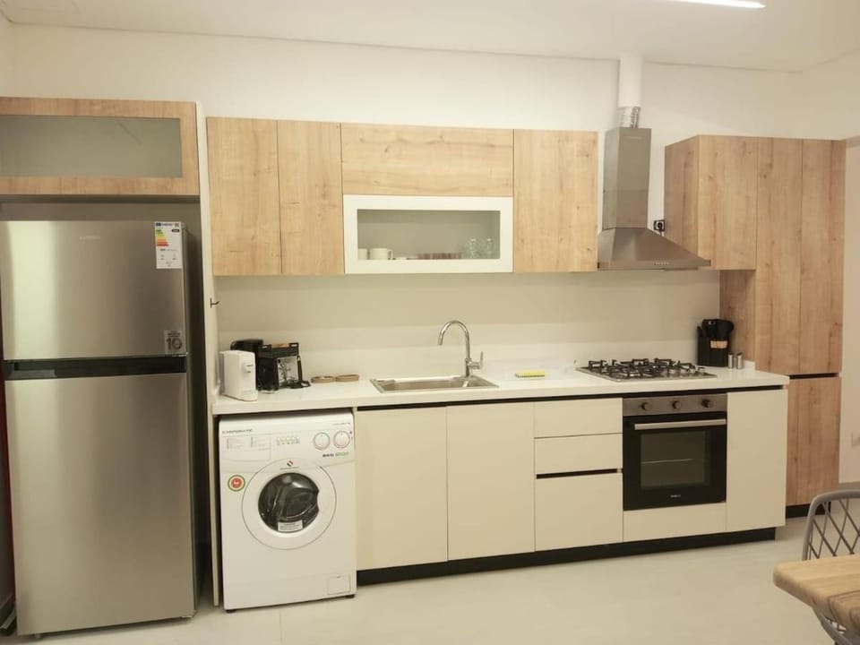 Kitchen or kitchenette, oven, stove, toaster, washing machine, dryer