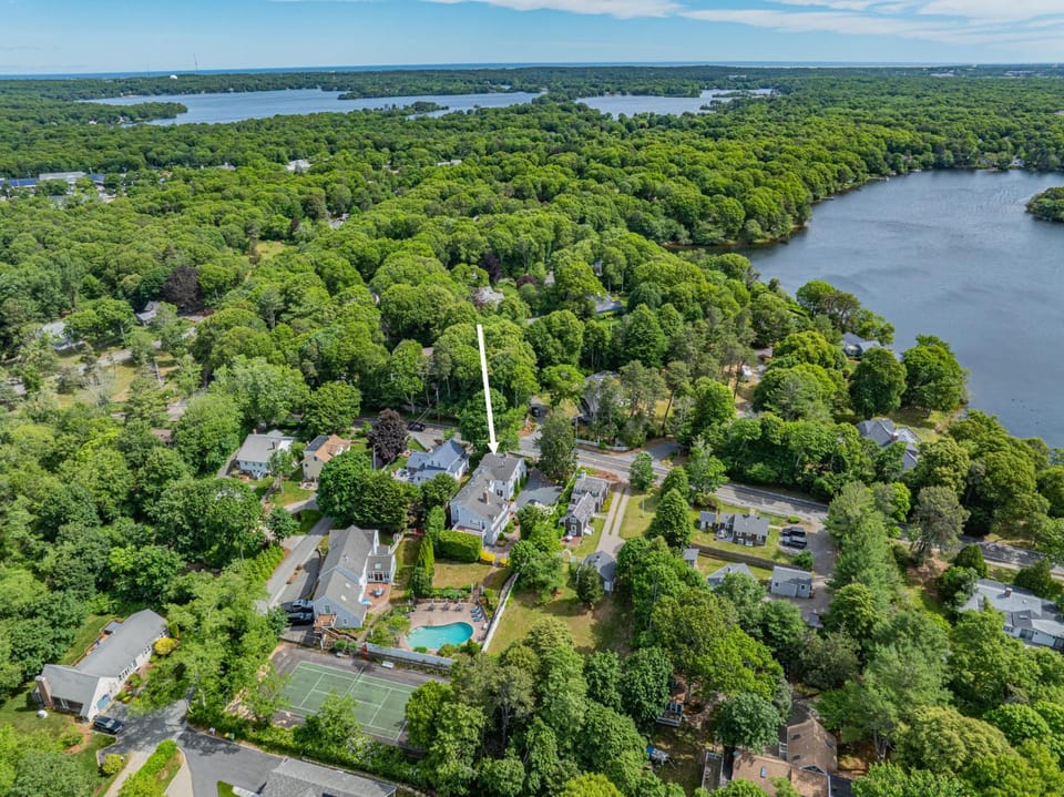 Pool and tennis court close to Craigville Beach House in Centerville
