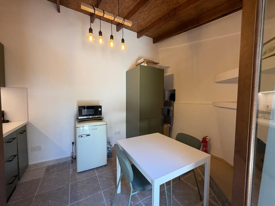 Kitchen or kitchenette, Dining area, microwave, laundry, washing machine, dryer