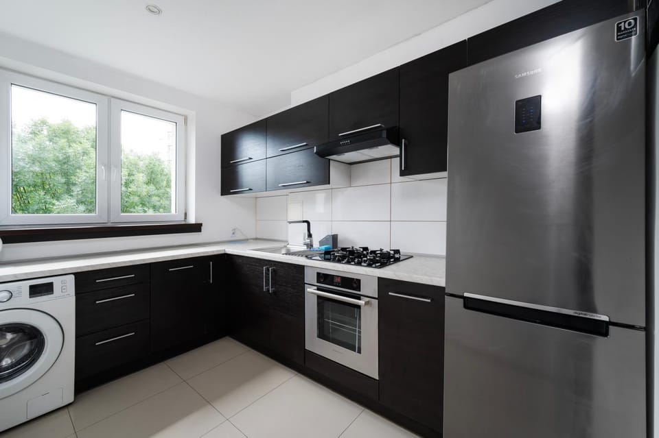 Kitchen or kitchenette, dishwasher, oven, stove, washing machine