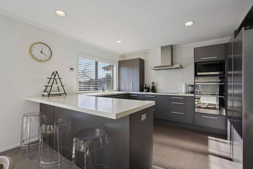 Kitchen or kitchenette, dishwasher, oven, stove