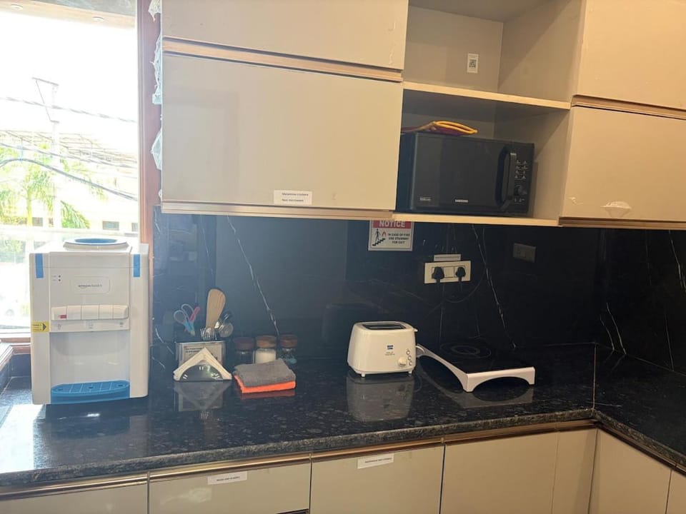 Kitchen or kitchenette, stove, toaster