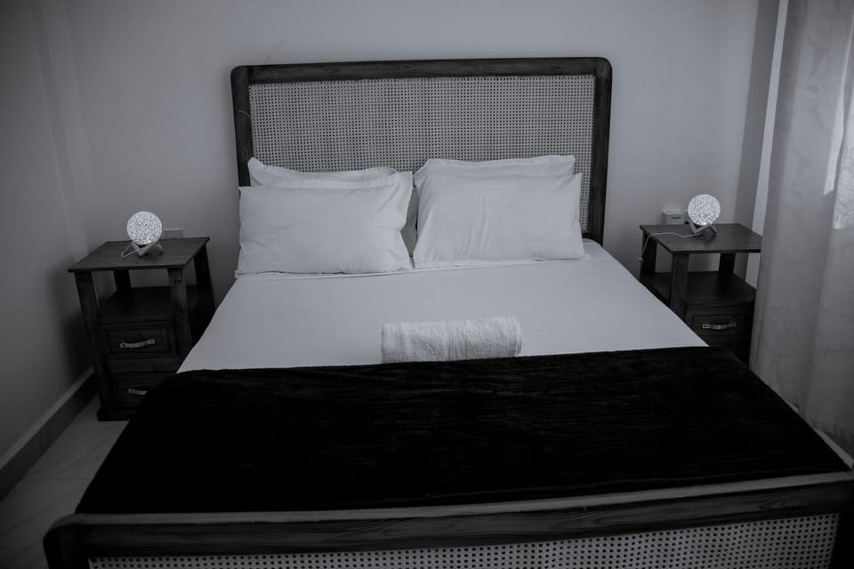 Bed, Decorative detail, Bedroom, hair dryier, towels, air conditioner