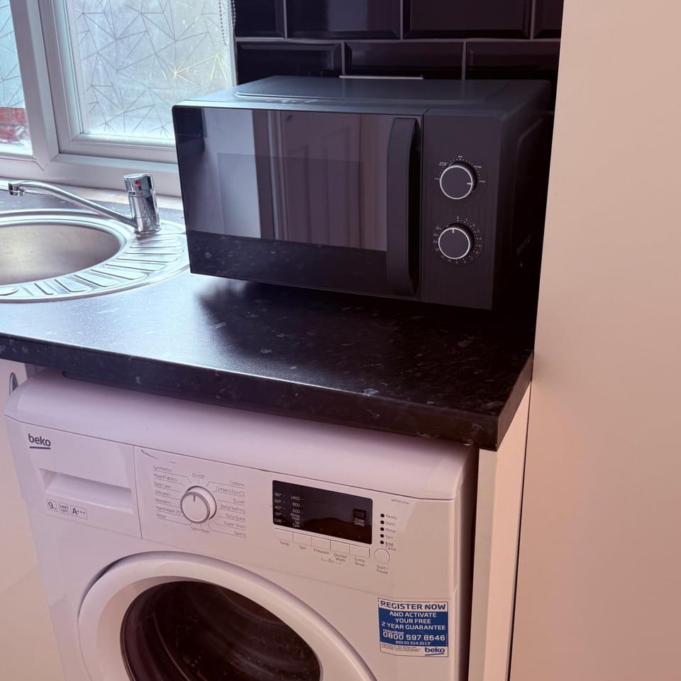 Kitchen or kitchenette, washing machine