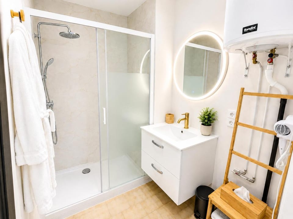 Shower, hair dryier, towels, wardrobe
