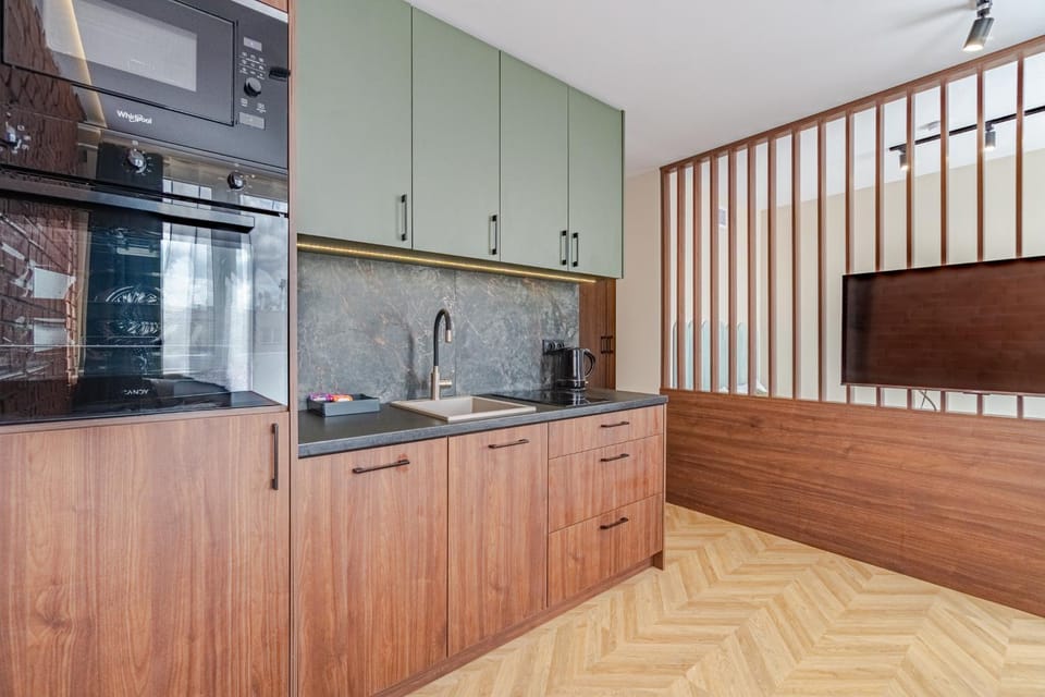 Kitchen or kitchenette, dishwasher, oven, stove