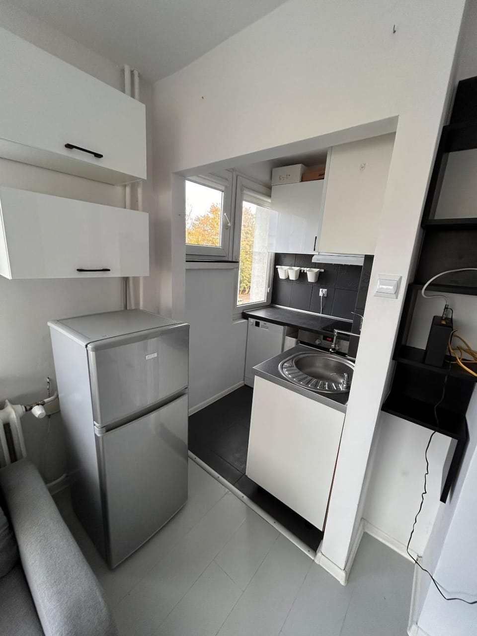 Kitchen or kitchenette, dishwasher, oven, stove