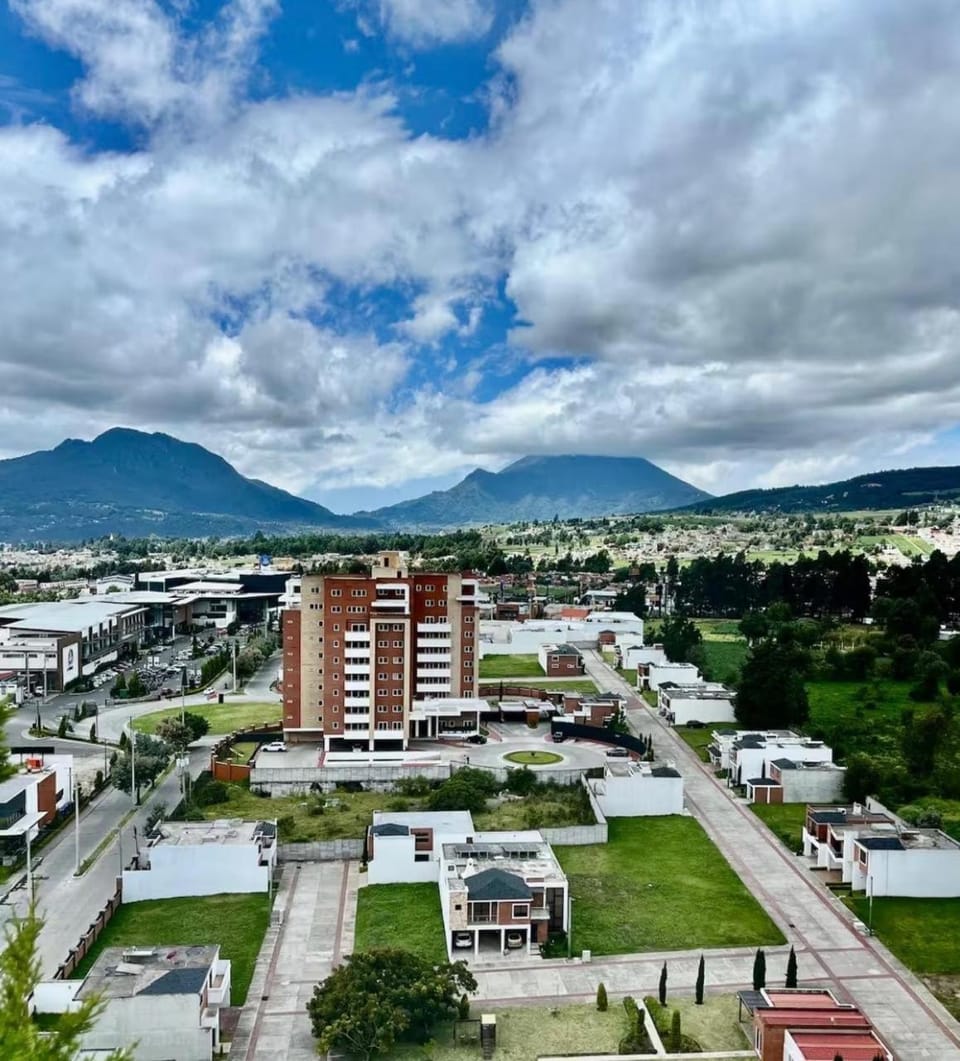 Property building, Nearby landmark, Day, Neighbourhood, Natural landscape, Bird's eye view, City view, Mountain view, Street view, Location