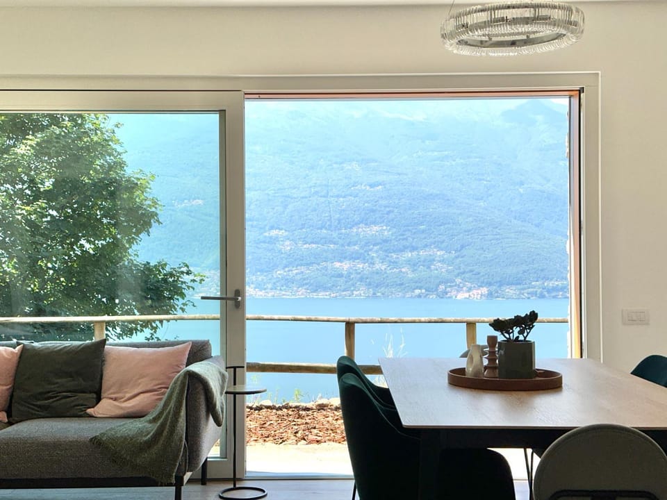 View (from property/room), Living room, Seating area, Dining area, Lake view