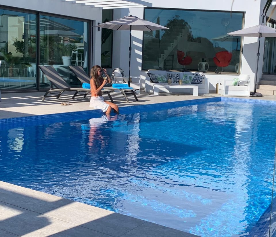 Property building, Living room, Swimming pool