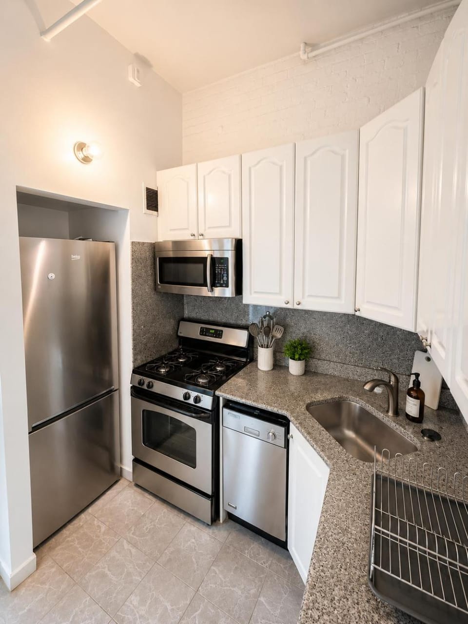 Kitchen or kitchenette, dishwasher, oven, stove