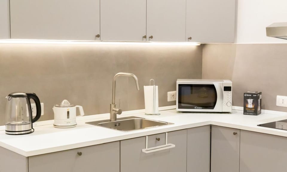 Coffee/tea facilities, Kitchen or kitchenette, Seating area, oven, kitchen, kitchen