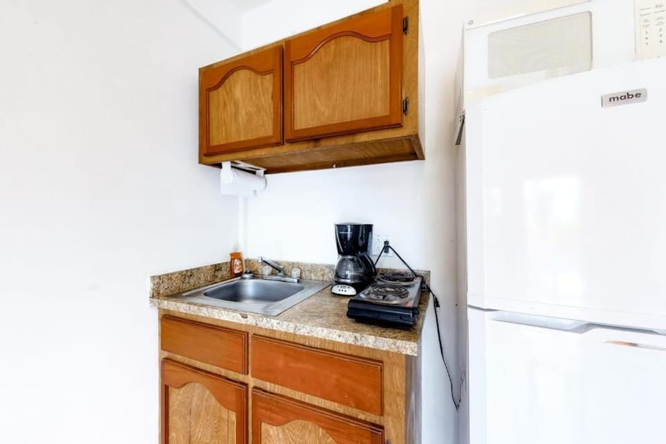 Affordable Suite on Gated Property with Rooftop Deck WiFi AC and Shared Pool Apartment in Belize District