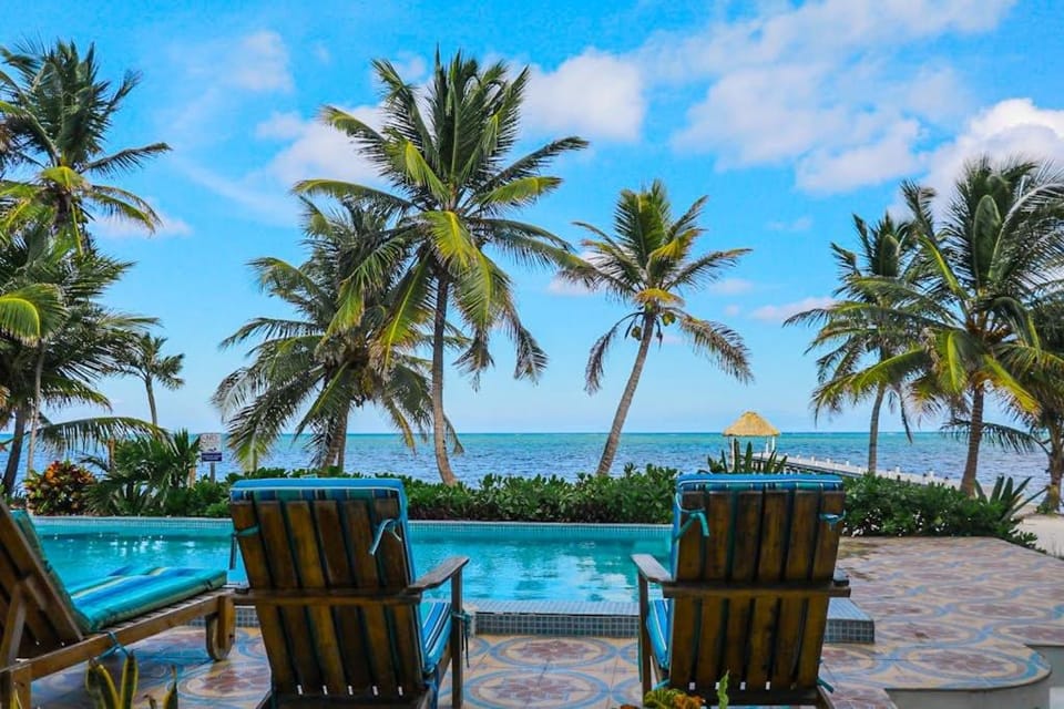 Serene oceanfront condo with shared pool ocean view WiFi & partial AC House in Belize District