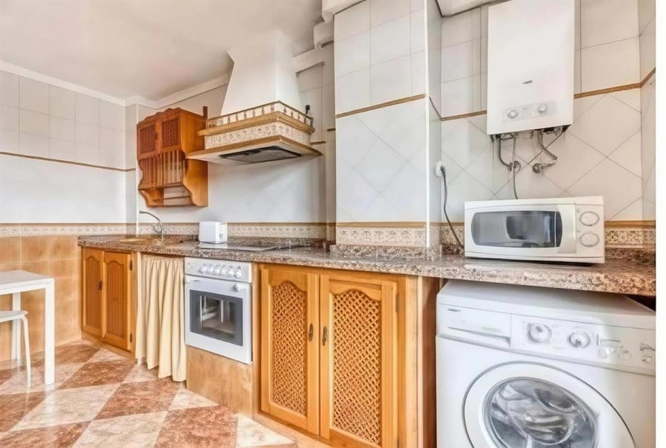 Kitchen or kitchenette, microwave, oven, stove, washing machine, kitchen
