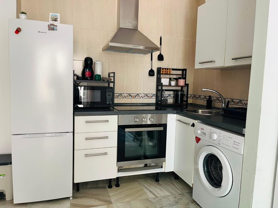 Kitchen or kitchenette, microwave, stove