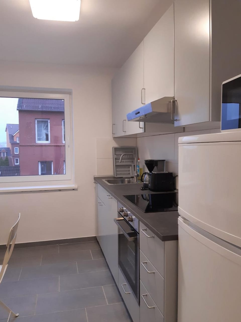 Kitchen or kitchenette, dishwasher, oven, stove