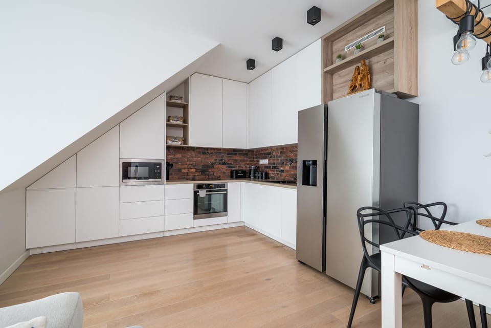 Kitchen or kitchenette, dishwasher, oven, stove