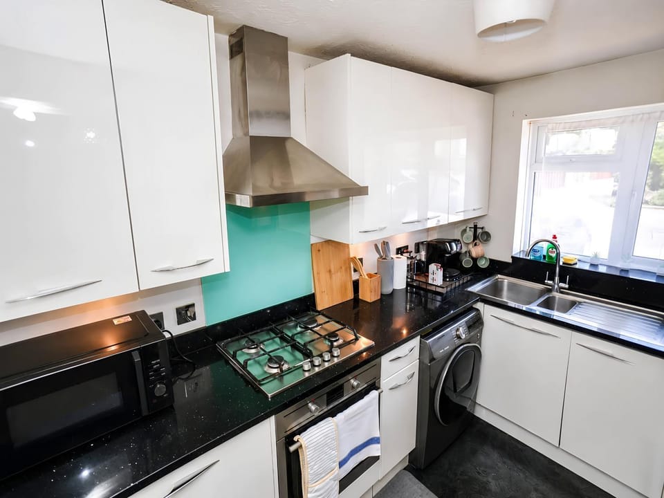 Kitchen or kitchenette, dishwasher, oven, stove, toaster