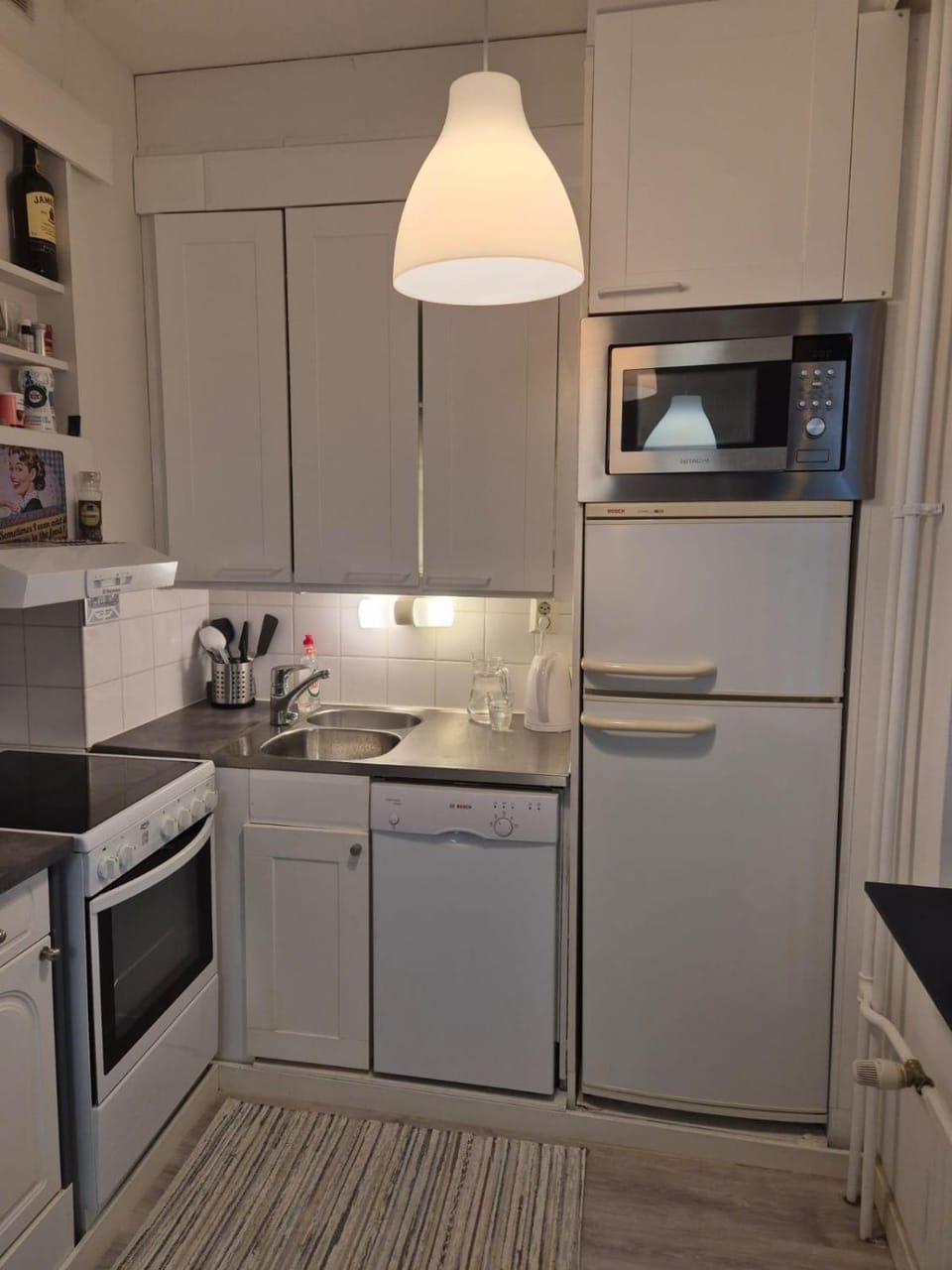 Kitchen or kitchenette, dishwasher, oven, stove