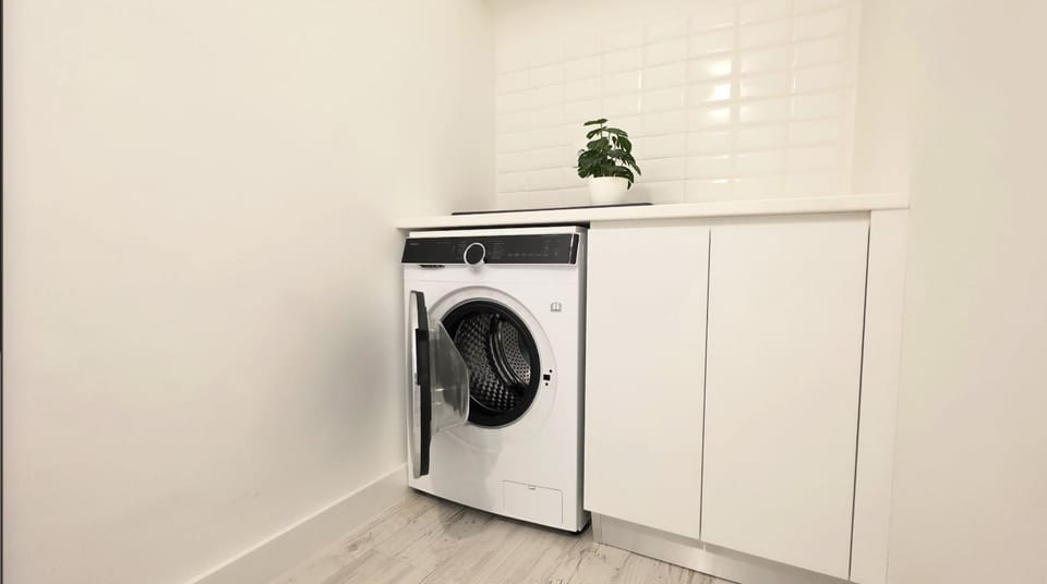 Kitchen or kitchenette, wardrobe, washing machine, dryer