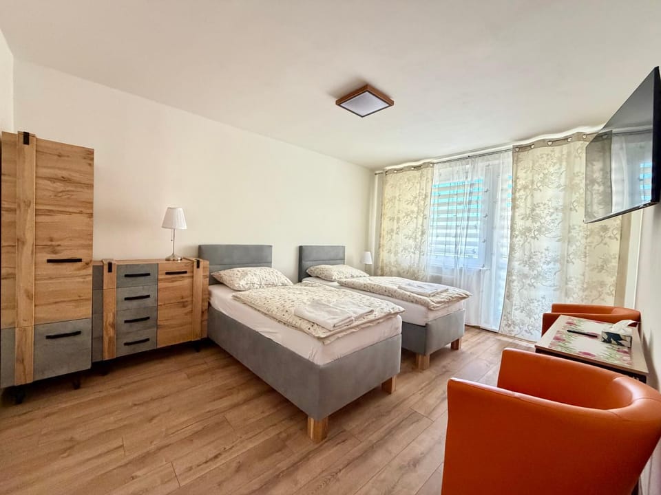 Bed, TV and multimedia, Seating area, Bedroom, towels, wardrobe