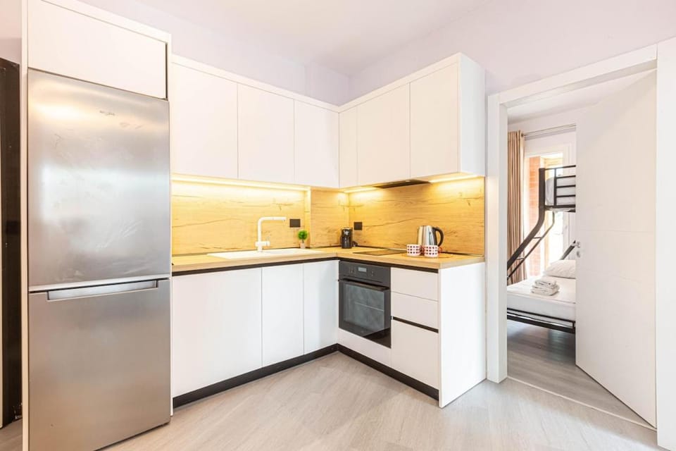 Kitchen or kitchenette, dishwasher, oven, stove