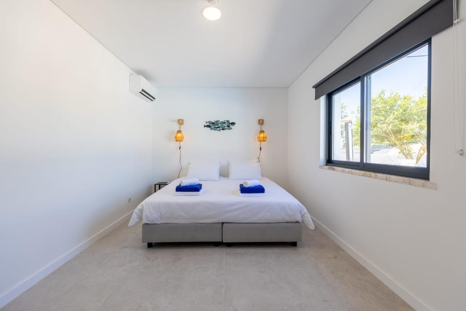 Bed, Photo of the whole room, Bedroom, towels, air conditioner
