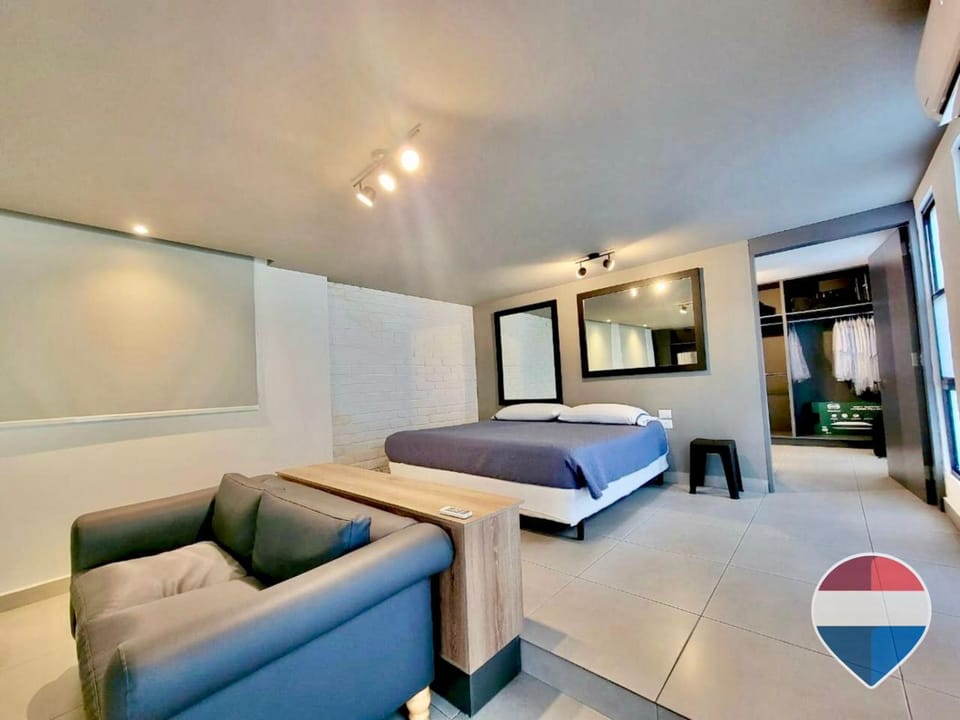 Bed, TV and multimedia, Living room, Photo of the whole room, Seating area, Bedroom