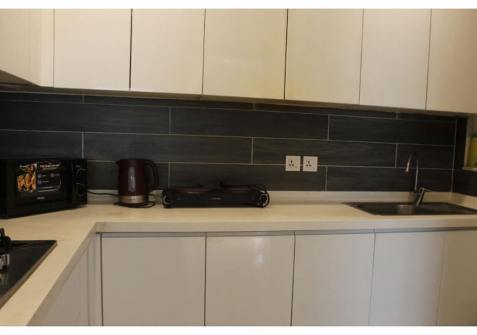 The Charcoal Suite Stylish 2BR at Opus Apartment in Lahore