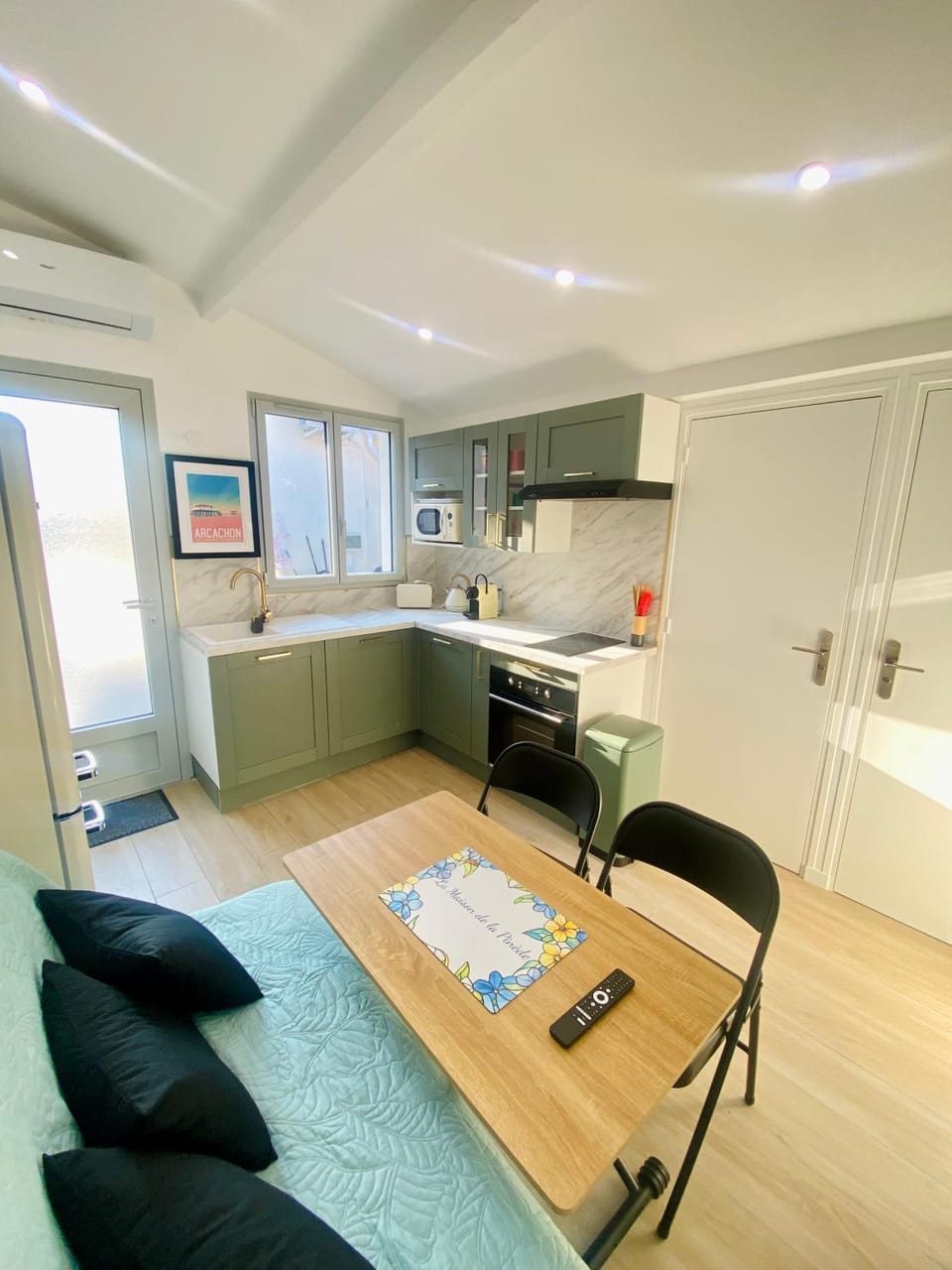 Kitchen or kitchenette, stove, air conditioner