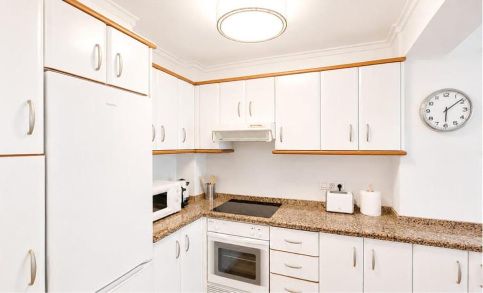 Kitchen or kitchenette, stove, toaster