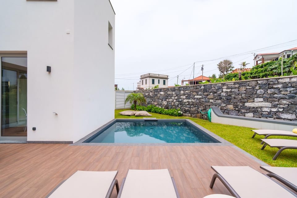 Property building, Patio, Pool view, Swimming pool, sunbed