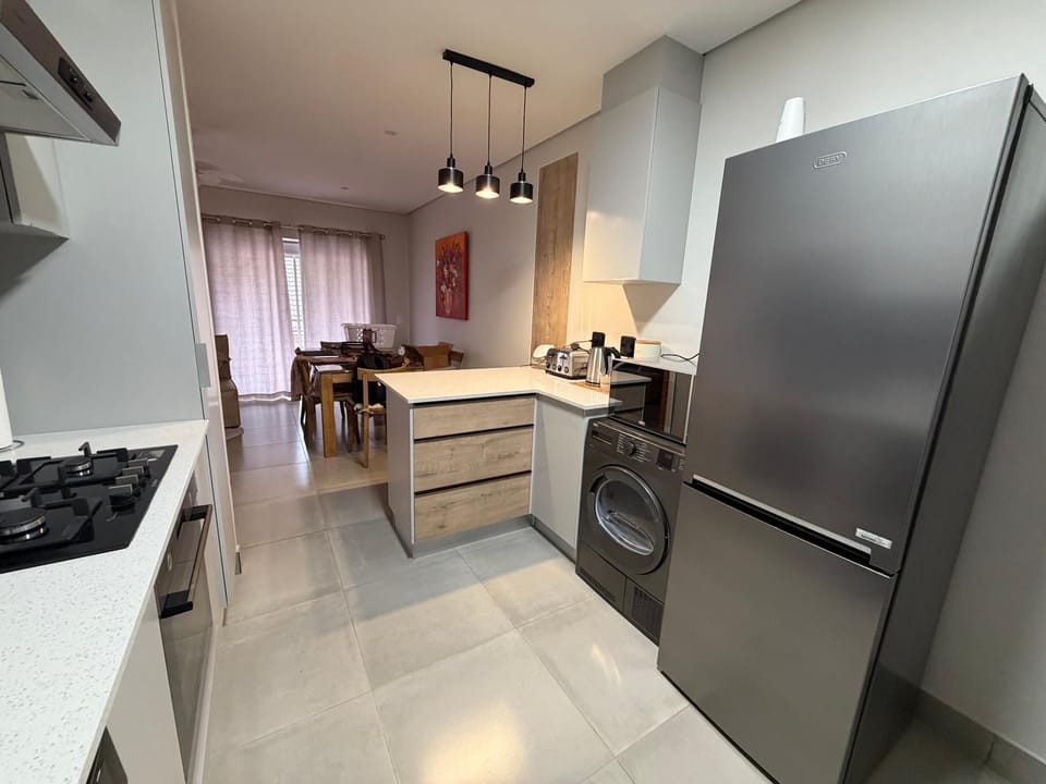 Kitchen or kitchenette, dishwasher, oven, stove
