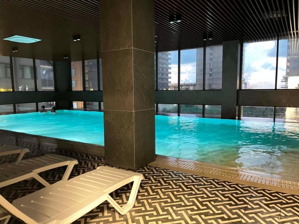 Modern 1BR Seaside Apartment, Walk to the Beach Apartment in Batumi