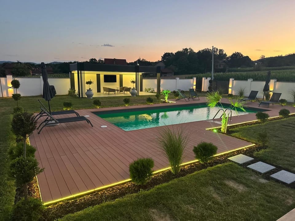 Property building, Patio, Pool view, Swimming pool, sunbed