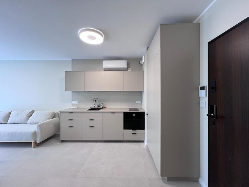 Kitchen or kitchenette, microwave, oven, stove, kitchen, air conditioner
