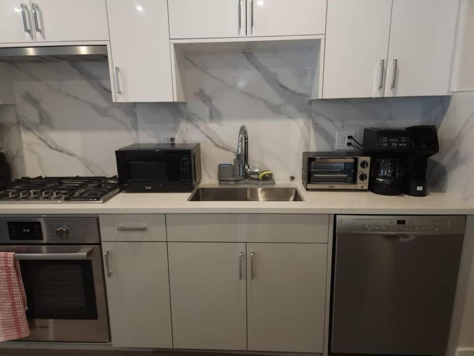 Kitchen or kitchenette, dishwasher, oven, stove, toaster