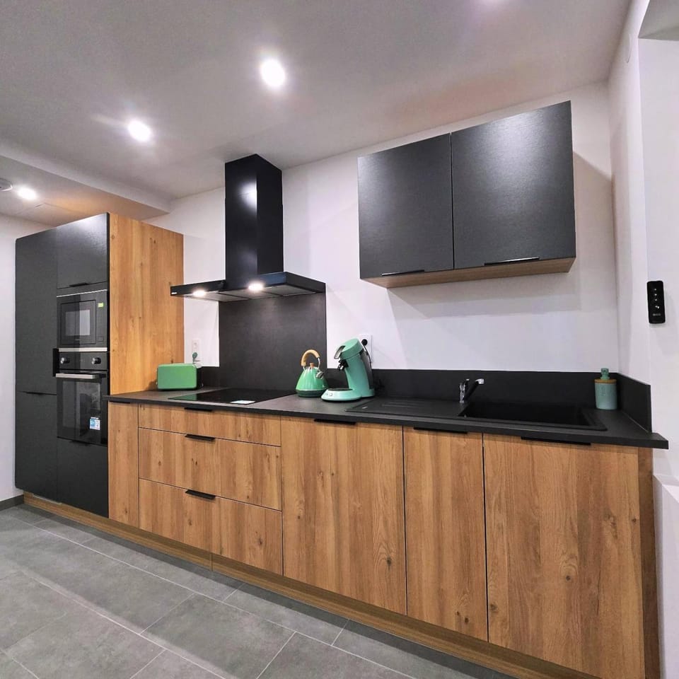 Kitchen or kitchenette, dishwasher, oven, stove