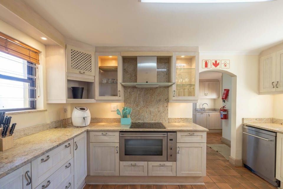 Kitchen or kitchenette, dishwasher, oven, stove