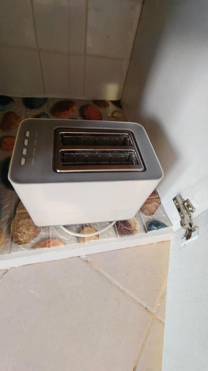Kitchen or kitchenette, stove, toaster, toaster