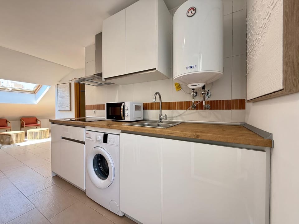 Kitchen or kitchenette, stove, washing machine