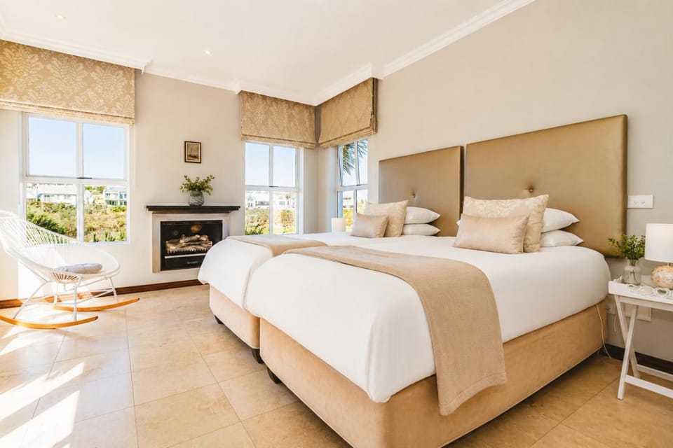 Bed, Seating area, Bedroom, fireplace, wardrobe