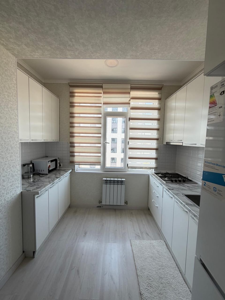 Kitchen or kitchenette, microwave, stove