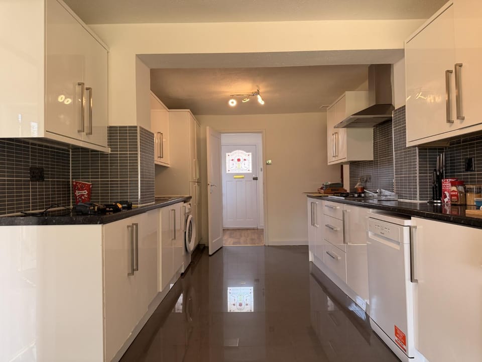 Kitchen or kitchenette, dishwasher, oven, stove