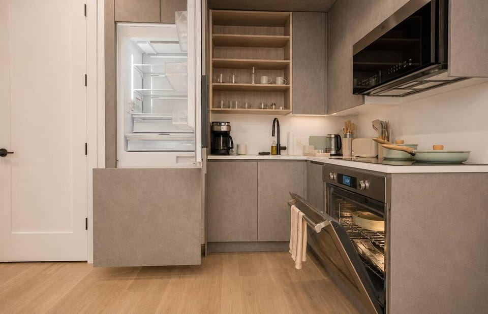 Kitchen or kitchenette, dishwasher, oven, stove, toaster