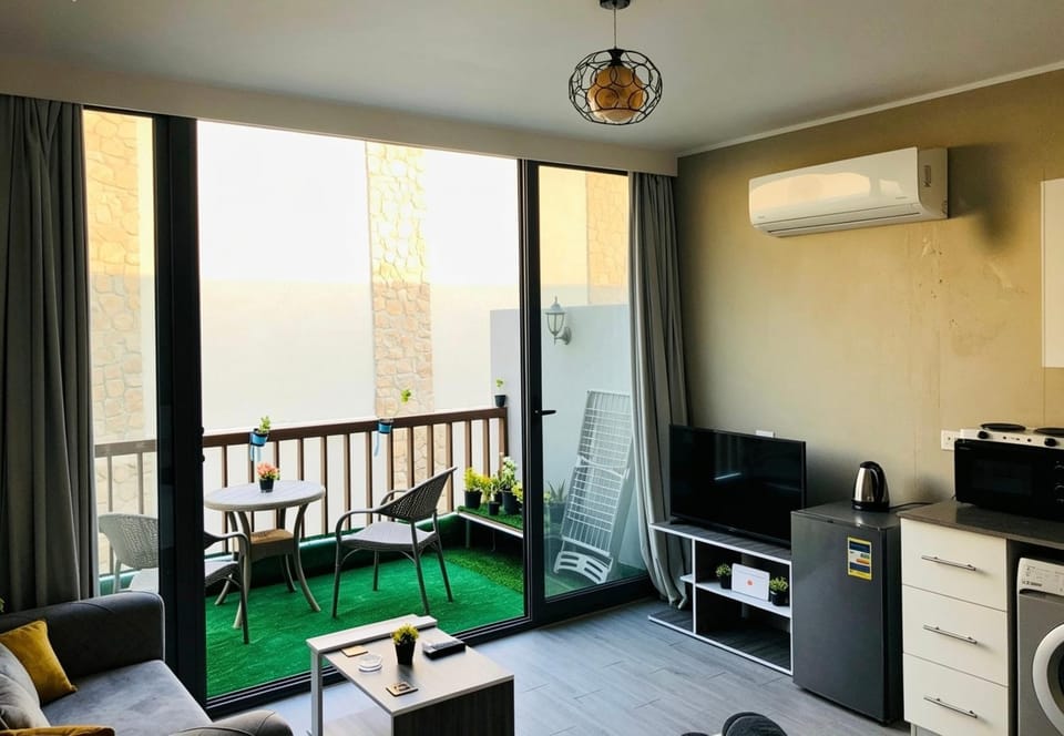 TV and multimedia, Kitchen or kitchenette, Seating area, air conditioner