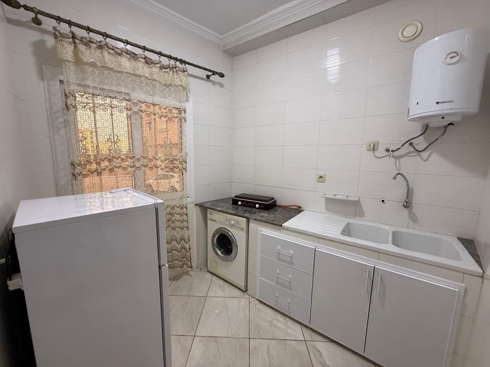 Kitchen or kitchenette, washing machine, dryer