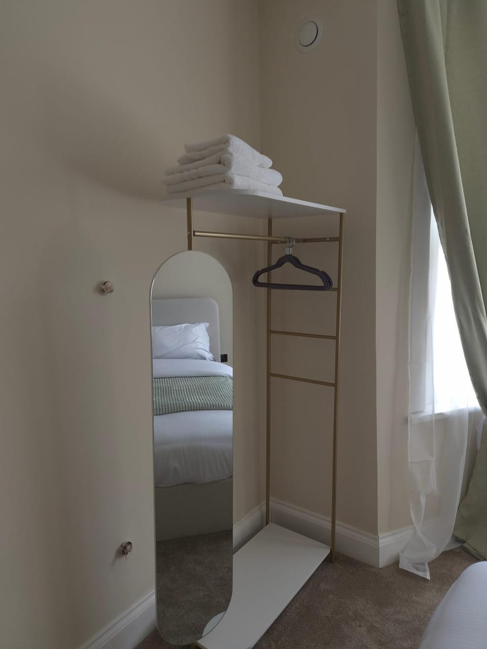 Bed, towels, wardrobe