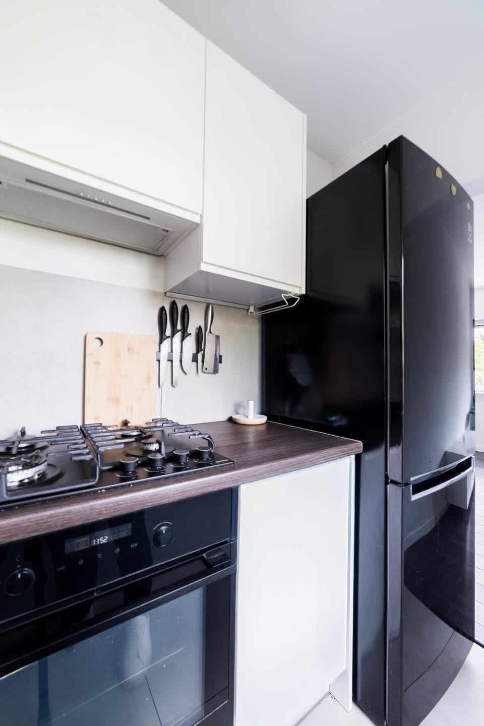 Kitchen or kitchenette, dishwasher, oven, stove